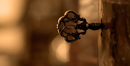 Picture of old-fashioned key in a lock