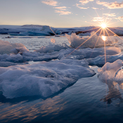 Sun setting over an icy body of water
